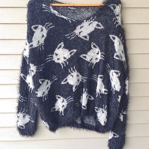 Fuzzy black and white cat sweater